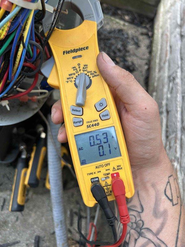 Responded to no cooling complaint on 6-year-old electric AC system with outdoor unit repeatedly tripping breaker. Performed electrical diagnostics using clamp meter at outdoor unit, measuring voltage and amperage at compressor circuit and control board connections. Found abnormal current draw indicating potential compressor short or failed run capacitor causing overcurrent condition and breaker trips.