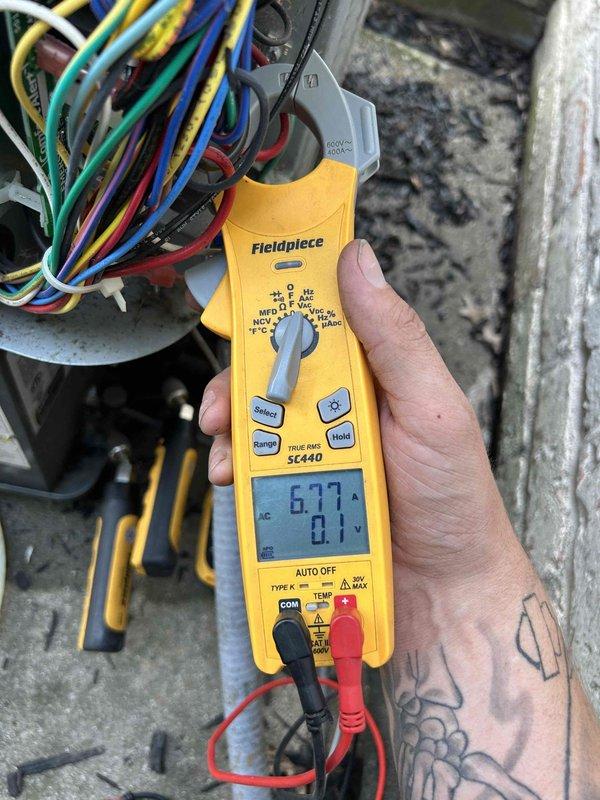 Responded to no cooling complaint on 6-year-old electric AC system with outdoor unit repeatedly tripping breaker. Performed electrical diagnostics using clamp meter at outdoor unit, measuring voltage and amperage at compressor circuit and control board connections. Found abnormal current draw indicating potential compressor short or failed run capacitor causing overcurrent condition and breaker trips.