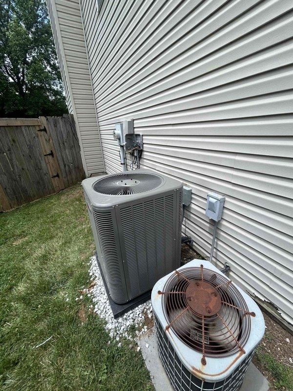 Completed residential installation of Lennox 2-ton 14.7 SEER2 air conditioning system for second floor, including ML14KC1-024-230 condenser unit and CK40HT-24B-71 evaporator coil. Removed and disposed of existing heavily rusted AC unit that showed significant deterioration on exterior casing and fan grille. Installed new condenser on existing gravel pad against exterior wall with proper clearances, connected refrigerant lines to new evaporator coil in attic location, and exercised caution around existing condensate line and 90% furnace flue during coil installation. Utilized existing thermostat for system control. Evacuated refrigerant lines to proper vacuum levels, charged system to manufacturer specifications, and verified proper refrigerant pressures and temperatures using calibrated gauges. Tested system operation and confirmed adequate airflow and cooling performance. Secured all necessary permits and ensured installation met current code requirements. Existing equipment removed f
