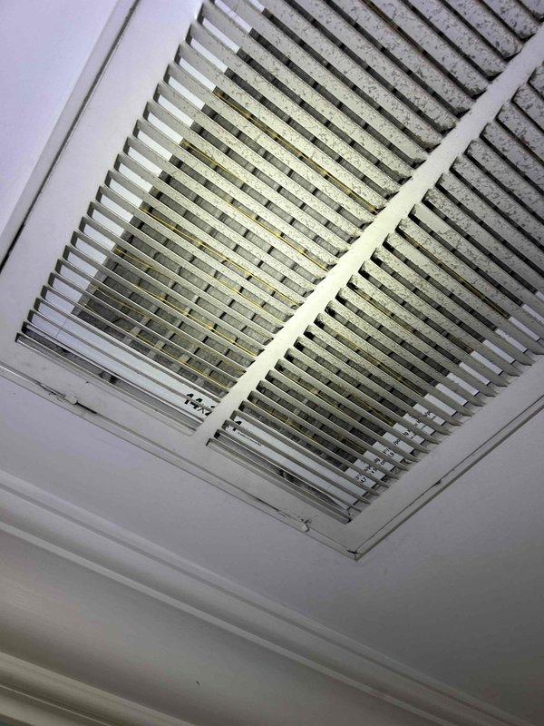 # No Cooling - 10 Year Old System

Responded to service call for complete loss of cooling affecting entire home with 10-year-old air conditioning system. Upon arrival, performed initial assessment of indoor air handler and return air system. Inspected ceiling-mounted return air grille and noted dust accumulation on internal surfaces, indicating potential airflow restriction issues.

Accessed attic space to evaluate air handler unit and ductwork components. Utilized diagnostic equipment with integrated LED illumination to perform detailed inspection of HVAC system in low-light conditions. Examined flex duct connections and verified integrity of supply ductwork. Assessed insulation coverage around mechanical components and verified proper installation clearances.

Conducted electrical diagnostics using handheld meter to test voltage, amperage, and capacitance values at air handler. Checked for proper power supply to unit and verified control board functionality. Inspected condensate drai