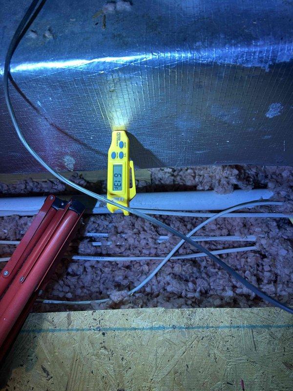 # No Cooling - 10 Year Old System

Responded to service call for complete loss of cooling affecting entire home with 10-year-old air conditioning system. Upon arrival, performed initial assessment of indoor air handler and return air system. Inspected ceiling-mounted return air grille and noted dust accumulation on internal surfaces, indicating potential airflow restriction issues.

Accessed attic space to evaluate air handler unit and ductwork components. Utilized diagnostic equipment with integrated LED illumination to perform detailed inspection of HVAC system in low-light conditions. Examined flex duct connections and verified integrity of supply ductwork. Assessed insulation coverage around mechanical components and verified proper installation clearances.

Conducted electrical diagnostics using handheld meter to test voltage, amperage, and capacitance values at air handler. Checked for proper power supply to unit and verified control board functionality. Inspected condensate drai