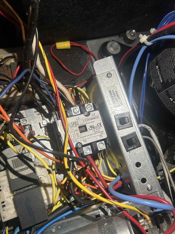 Responded to no cooling complaint on 13+ year old geothermal system blowing room temperature air with 8-degree temperature differential between setpoint and actual room temperature. Diagnosed failed contactor preventing compressor operation. Replaced defective contactor with new unit, restored proper electrical connections, and verified system operation with adequate cooling performance upon completion.