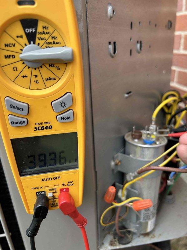 Completed Gold Level prepaid maintenance on single-system residential air conditioning unit with gas furnace and humidifier located in basement. Performed comprehensive system inspection including electrical testing with digital multimeter, confirming proper voltage readings at 239V, inspected capacitor connections and wiring integrity at junction box, and examined air handler internal components including evaporator coil, blower motor assembly, and refrigerant lines. All components found operating within normal parameters with typical dust accumulation; system functioning properly with no deficiencies noted.
