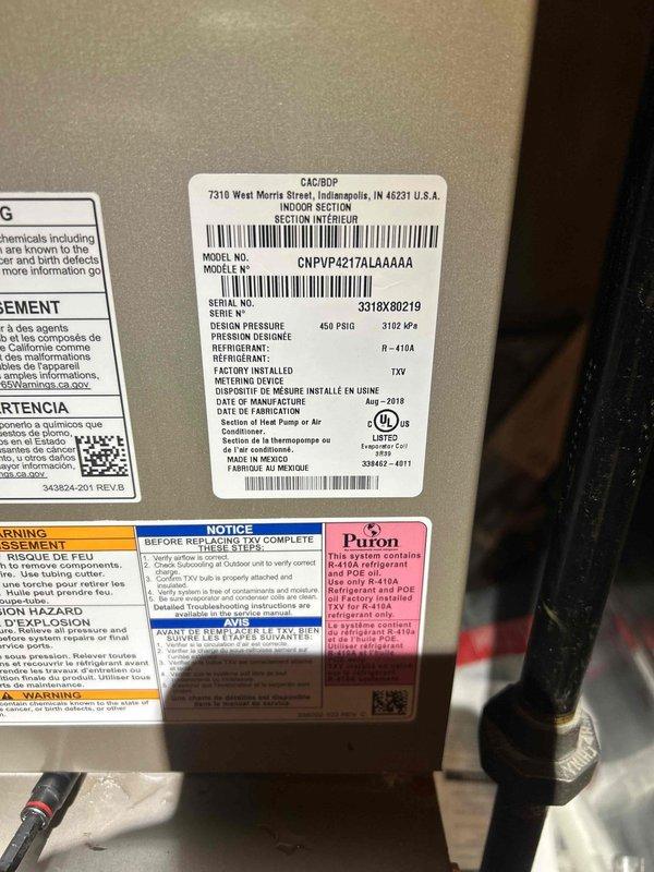Responded to no cooling complaint on 6-year-old Carrier split system (Model: CNPVP4217ALA4AAA, Serial: 3318X80219, manufactured August 2018) where thermostat was set to 65°F but indoor temperature remained at 68°F with inadequate cooling throughout the home. Upon arrival, performed comprehensive system diagnostics including refrigerant charge verification, airflow measurements, electrical component testing, and operational analysis to identify the root cause of insufficient cooling capacity. Documented equipment nameplate information and system specifications for service records, noting R-410A refrigerant type and 450 PSIG design pressure rating on the outdoor condensing unit.