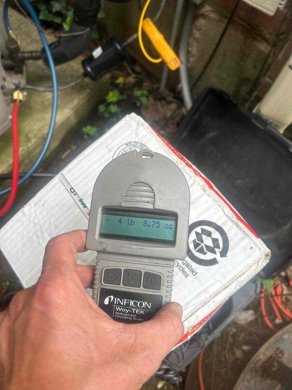 Responded to no cooling call on heat pump system running 3-4 degrees above setpoint. Upon arrival, performed diagnostic testing using manifold gauges and multimeter to assess system performance. Testing revealed low refrigerant charge. Connected recovery equipment and refrigerant scale to system. Added 4 pounds 8.75 ounces of refrigerant to bring system to proper charge level per manufacturer specifications. Verified proper pressures on both high and low sides using gauge set. Tested electrical components and confirmed amperage draw within normal operating range at 8.12 amps. System now cooling properly and maintaining desired temperature setpoint. All equipment operating as designed.