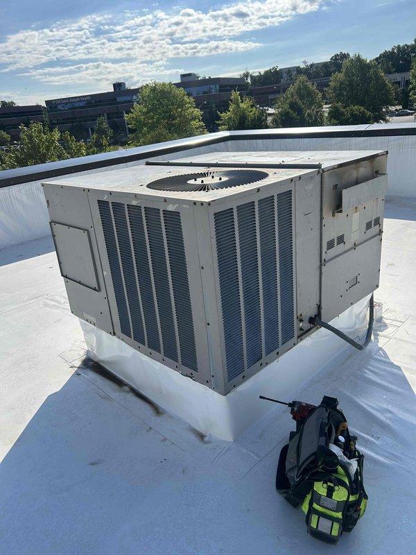 Responded to no cooling complaint for rooftop packaged HVAC unit serving upstairs office area. Upon arrival, accessed commercial rooftop unit and performed diagnostic evaluation of system components. Inspected package unit exterior condition, verified airflow through louvers, and checked operational status of equipment to identify cause of cooling failure and restore comfort to occupied space.