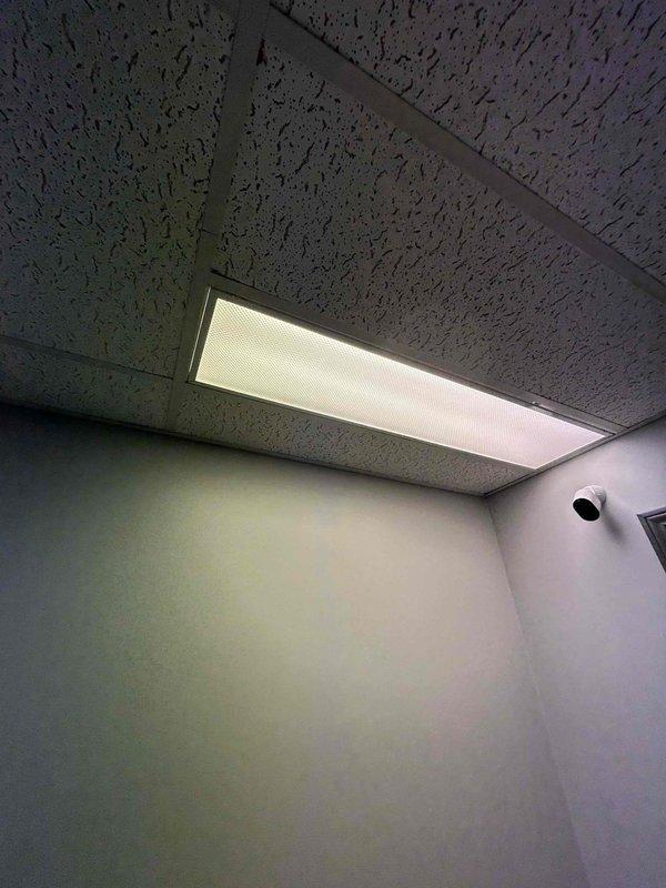 Conducted comprehensive electrical assessment of commercial fluorescent lighting system. Evaluated six non-functional fluorescent tube light fixtures with suspected ballast failure and inspected twenty-eight additional four-lamp fluorescent fixtures requiring replacement throughout the facility. Documented existing conditions including recessed troffer-style fixtures with acoustic drop ceiling installation, noted fixture housing conditions, and assessed electrical infrastructure requirements for complete fixture replacement project.