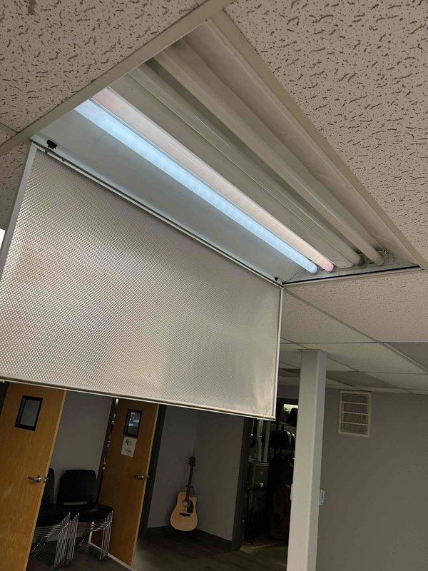 Conducted comprehensive electrical assessment of commercial fluorescent lighting system. Evaluated six non-functional fluorescent tube light fixtures with suspected ballast failure and inspected twenty-eight additional four-lamp fluorescent fixtures requiring replacement throughout the facility. Documented existing conditions including recessed troffer-style fixtures with acoustic drop ceiling installation, noted fixture housing conditions, and assessed electrical infrastructure requirements for complete fixture replacement project.