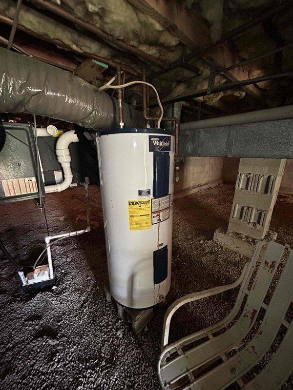 Returned to property to complete wiring installation between furnace and outdoor unit. Ran shielded gray wire from indoor furnace location through crawlspace to ODU as specified, ensuring proper connection and signal communication between components. Verified system operation and documented existing crawlspace conditions including water heater installation and overhead moisture damage for customer awareness.
