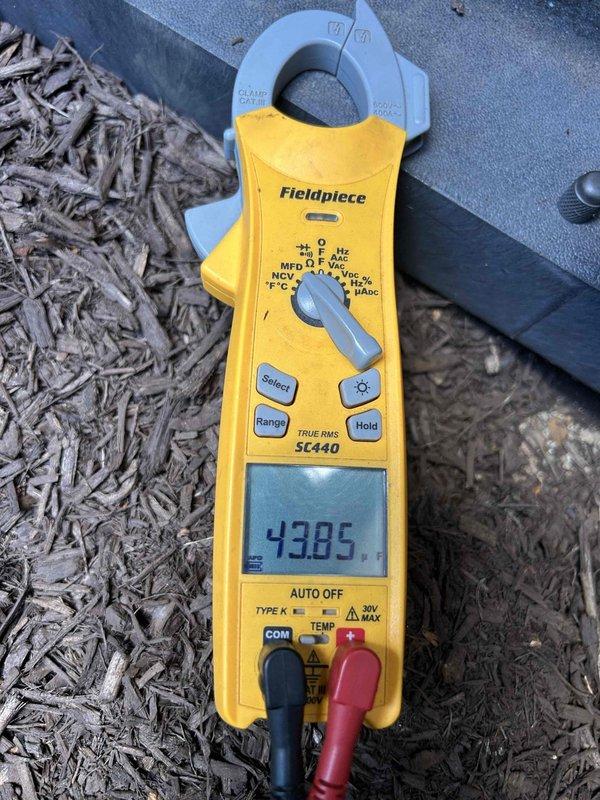 Completed comprehensive maintenance tune-up on single-zone HVAC system consisting of one heat pump condenser unit and one air handler. Performed refrigerant system diagnostics using manifold gauge set, confirming R-410A charge levels with suction pressure at 242.7 psig and discharge pressure at 809 psig. Measured electrical performance at condenser unit using clamp meter, recording amperage draw to verify compressor operation within manufacturer specifications. Installed new 20x30x1 air filter at air handler to maintain proper airflow and system efficiency. All system parameters found to be operating within normal range upon completion of preventive maintenance service.