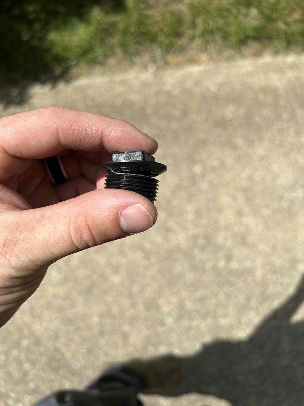 Responded to water leak at indoor HVAC unit in basement. Upon inspection, discovered missing drain plug on condensate system causing steady drip onto floor and surrounding area. Located and reinstalled proper threaded drain plug, tested system operation, and confirmed leak was resolved with no further water discharge.