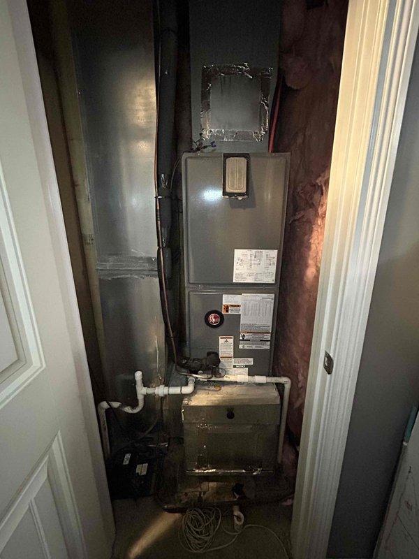 Responded to no cooling complaint on approximately 10-year-old electric air conditioning system where downstairs indoor air handler was running but outdoor condenser unit failed to operate. Performed diagnostic evaluation of split system including visual inspection of outdoor condenser unit and indoor air handler equipment. Troubleshot electrical circuit, checked disconnect box operation, and tested control voltage between indoor and outdoor units to isolate communication failure preventing compressor operation.