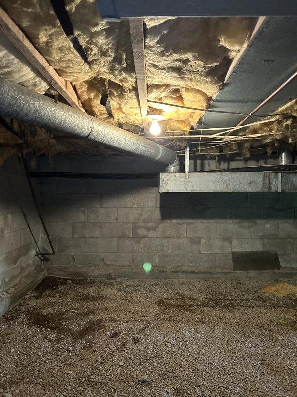 Conducted on-site assessment of leaking water heater in basement crawl space. Inspected existing Whirlpool residential water heater unit, documented copper supply line connections, PVC discharge piping configuration, and identified source of leak requiring replacement. Evaluated customer's request for hose spigot relocation work and provided comprehensive estimate for water heater replacement and plumbing modifications.