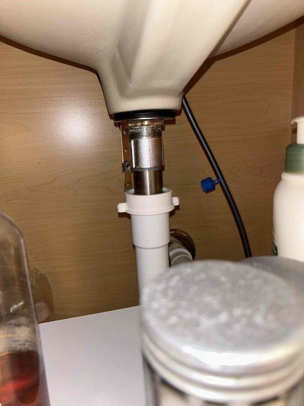Completed USA Bronze Tankless annual maintenance service including 65-point whole home inspection. Flushed tankless water heater system to remove mineral buildup and scale deposits, verified proper water flow and temperature output at fixtures, and inspected drain assemblies and plumbing connections under bathroom sink for leaks or deterioration. All components found to be functioning within normal parameters with no immediate repairs required.