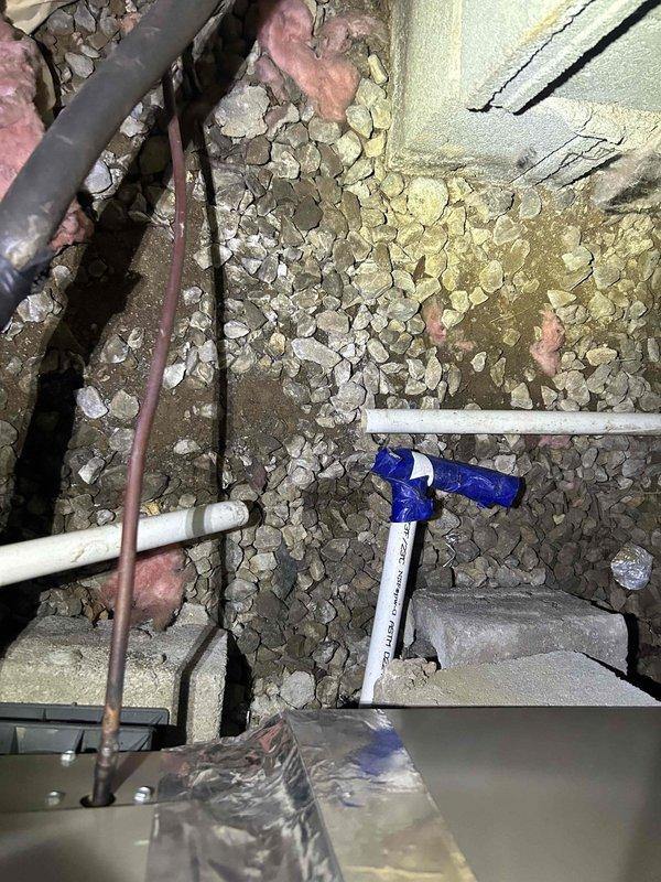 Responded to customer complaint of foul odor emanating from ductwork and permeating throughout the residence. Performed comprehensive inspection of HVAC system including crawlspace access to examine ductwork integrity and identify odor source. Located heavily soiled air filter with significant dust and debris accumulation, which was contributing to poor air quality and musty smell circulation. Inspected exposed ductwork, copper refrigerant lines with insulation, PVC condensate drainage, and flexible ducting in crawlspace area for signs of moisture intrusion, biological growth, or structural damage that could cause odors. Documented condition of filter media showing dark brown discoloration and verified filter housing unit accessibility. Examined crawlspace environment including gravel vapor barrier coverage and building infrastructure for potential moisture issues or organic material decomposition that could generate crawlspace odors being drawn into the air distribution system.