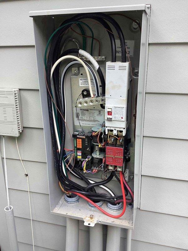 Completed annual preventive maintenance on residential Generac automatic transfer switch and standby generator system. Performed comprehensive inspection of transfer switch panel, verified proper operation of emergency disconnect and main service disconnect mechanisms, and documented all electrical connections and component conditions. Inspected exterior-mounted control panel, ventilation systems, and conduit installations for proper weatherproofing and secure mounting. All wiring connections, including incoming service conductors and generator feed cables, were found to be properly terminated and secure. System tested and confirmed operational, with photographic documentation captured for maintenance records.