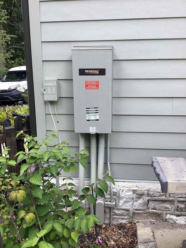 Completed annual preventive maintenance on residential Generac automatic transfer switch and standby generator system. Performed comprehensive inspection of transfer switch panel, verified proper operation of emergency disconnect and main service disconnect mechanisms, and documented all electrical connections and component conditions. Inspected exterior-mounted control panel, ventilation systems, and conduit installations for proper weatherproofing and secure mounting. All wiring connections, including incoming service conductors and generator feed cables, were found to be properly terminated and secure. System tested and confirmed operational, with photographic documentation captured for maintenance records.