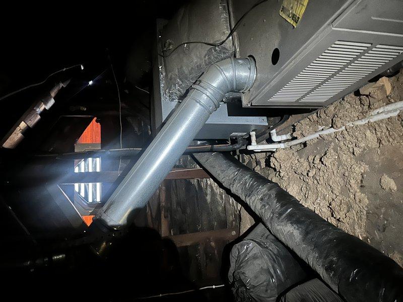 Conducted comprehensive estimate for complete HVAC system replacement of two existing gas furnace and air conditioning units, both approximately 20 years old and at end of serviceable life. Primary unit located in attic space and secondary unit in crawlspace, both requiring ladder access for evaluation. Inspected existing ductwork infrastructure in crawlspace, noting galvanized steel plenum connections and supply ductwork with metallic elbow transitions. Evaluated current system configuration including return air grilles, electrical wiring, and distribution components throughout both zones. Documented foundation-mounted equipment locations and existing duct sealing conditions. Customer requested immediate replacement timeline with specific exclusion of certain manufacturer brands from proposal options, with interest in financing solutions for dual-system replacement project.