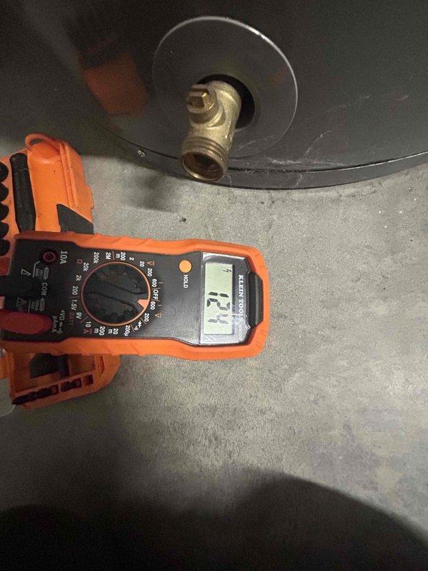 Responded to no hot water complaint on dual tanked water heater system installed in 2018. Upon arrival, observed solid orange indicator light on control box, with customer reporting warm but not hot water throughout home. Performed diagnostic testing using multimeter to check electrical supply and circuit integrity at disconnect box. Inspected control panel wiring connections, relay contacts, and heating element circuits on both units. Verified proper voltage supply and confirmed breakers were not tripped. Identified control board malfunction causing heating elements to operate at reduced capacity. Reset control system and tested water temperature output to verify restoration of full hot water delivery to home.