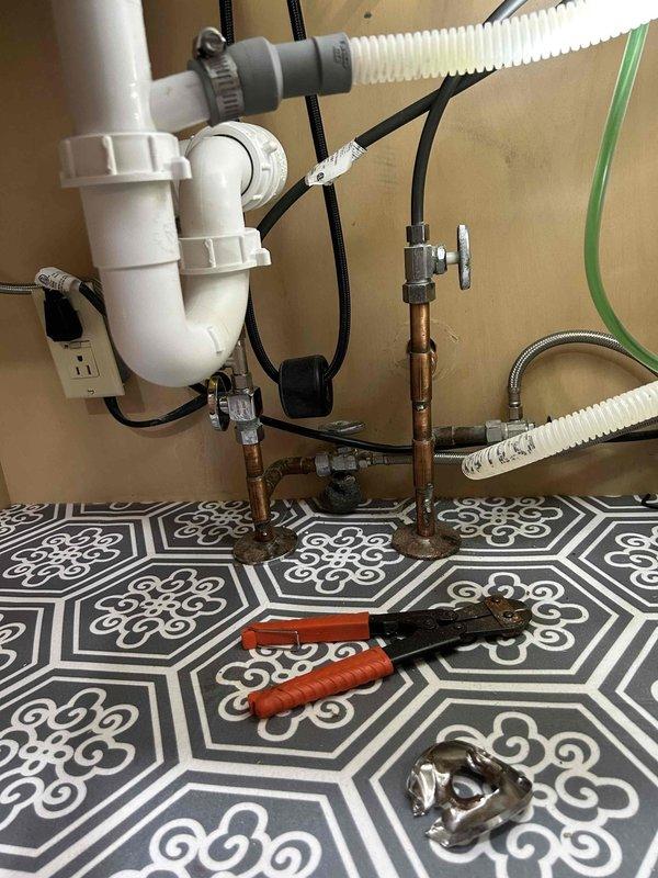 Completed comprehensive plumbing inspection as part of preventative service agreement, examining both interior and exterior plumbing fixtures and components. Interior inspection included under-sink P-trap assembly, drain piping, copper water supply lines with shutoff valves, and all visible connections, confirming proper installation and no signs of leaks or deterioration. Exterior inspection evaluated hose bib with vacuum breaker device and associated drainage piping, verifying operational functionality and proper mounting. All plumbing fixtures and components found to be in satisfactory working condition with no immediate service needs identified.