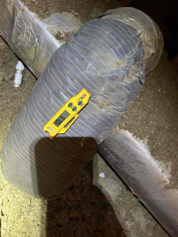 Responded to no cooling complaint on 4-year-old gas furnace/air conditioning system. Upon arrival, customer reported raccoon damage to ductwork in attic. Performed complete system inspection including electrical diagnostics at outdoor condensing unit using clamp meter to verify proper amperage draw and component operation. Accessed attic-mounted air handler and inspected flexible ductwork system. Found damaged duct insulation and compromised duct integrity from animal intrusion as reported. Documented existing conditions with photos showing worn reflective insulation wrap with tears exposing underlying duct material, and measured temperature differentials across affected ductwork sections. Verified outdoor unit electrical components functioning within normal parameters with 6.0 amp reading observed during testing. System operational but requires ductwork repair to restore proper airflow and efficiency.