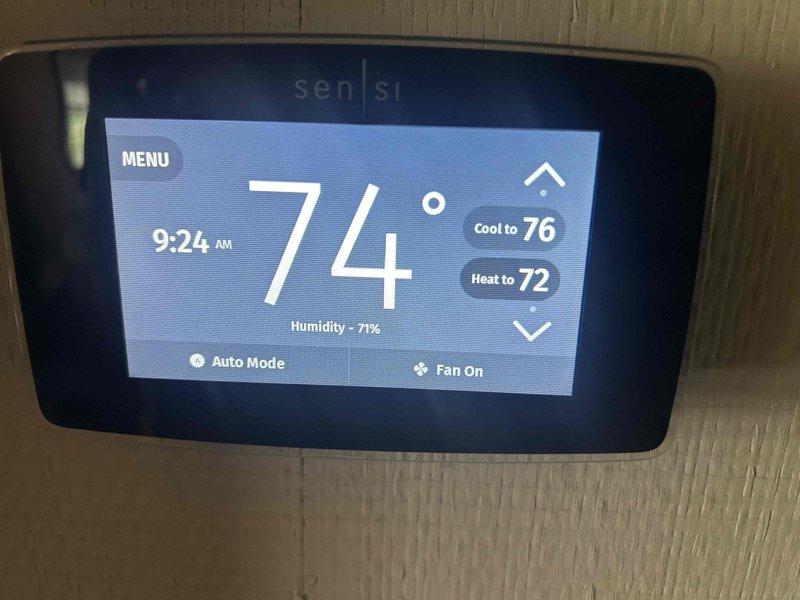 Responded to no-cool call on 10-year-old AC system with blower motor failure in crawlspace air handler. Upon inspection, found blower motor not operating in automatic mode as reported. Diagnosed faulty blower motor relay on control board preventing motor engagement when thermostat called for cooling. Observed significant debris accumulation in unit base including dust, dirt, and insulation fragments that could impact system performance. Verified thermostat communication and settings showing system in auto mode with fan-on configuration at time of service. Documented control board wiring connections and internal component condition for repair recommendations.