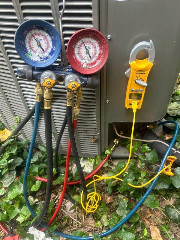 Responded to no cooling complaint on 3-year-old residential air conditioning system with gas furnace that was blowing warm air. Connected manifold gauge set to measure refrigerant pressures and used digital clamp meter to verify electrical readings at outdoor condensing unit. Performed diagnostic testing to identify root cause of cooling failure and determine necessary repairs to restore proper system operation.