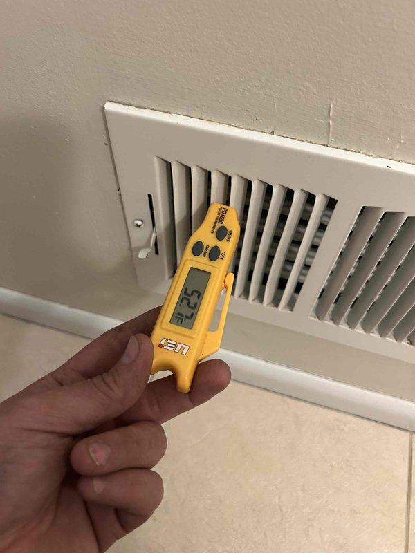 Responded to non-urgent service call for 15-year-old Carrier central air conditioning unit with outdoor fan motor failure. Outdoor fan was not spinning but could be manually rotated, indicating motor capacitor or motor failure rather than seized bearings. Verified indoor airflow and cooling operation at thermostat, confirmed system producing cool air despite outdoor fan malfunction. Performed diagnostic testing including visual inspection of outdoor unit, measured supply air temperature at register, and assessed overall system performance to determine outdoor fan motor required replacement to restore proper condenser operation and prevent compressor damage from inadequate heat dissipation.