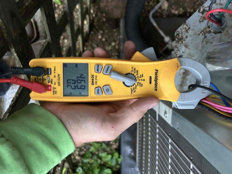 Completed semiannual air conditioning maintenance inspection on 4-year-old Bryant system under service contract. Performed comprehensive AC tune-up including electrical testing and system diagnostics using clamp meter to verify amperage draws and voltage readings at outdoor condenser unit. All measurements within normal operating parameters. Inspected condenser unit components, wiring connections, and outdoor equipment. System operating properly with no issues found. Customer provided 16x20x1 air filter for installation.