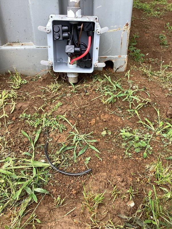 Verified and documented electrical service source for office space per landlord's request to confirm power origin. Inspected interior electrical panel labeled "Doctor" with associated conduit runs and exterior ground-level junction box with circuit protection devices. Photographically documented that office power is supplied from dedicated new service installation rather than museum electrical system, confirming independent electrical service to the office space.