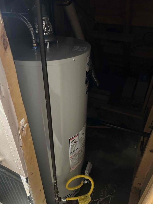 Replaced existing water heater with Bradford White Basic 50-gallon gas tall unit per customer request and previous estimate. Connected all water supply lines, installed proper venting with draft hood assembly, and attached yellow flexible gas line to unit. Verified all plumbing connections secure, tested gas connections for leaks, and confirmed proper exhaust venting through existing flue system.