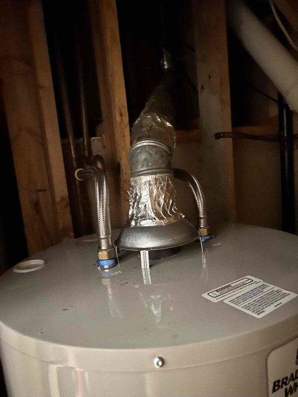 Replaced existing water heater with Bradford White Basic 50-gallon gas tall unit per customer request and previous estimate. Connected all water supply lines, installed proper venting with draft hood assembly, and attached yellow flexible gas line to unit. Verified all plumbing connections secure, tested gas connections for leaks, and confirmed proper exhaust venting through existing flue system.