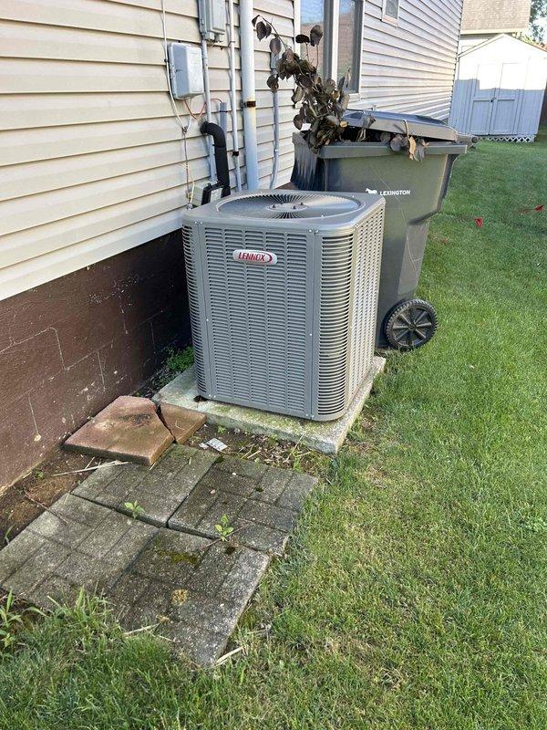 Completed annual care plan maintenance on air conditioning system with gas furnace located in attic space. Performed comprehensive tune-up inspection of indoor air handler unit, checking all operational components, electrical connections, and airflow systems. Verified proper operation of blower motor and examined ductwork connections for secure mounting and adequate insulation. Inspected outdoor Lennox condenser unit, noting significant fire or heat damage to surrounding area including charred material on adjacent trash receptacle and thermal damage to vinyl siding near electrical connection point. Documented damaged and displaced paver stones around equipment pad. Despite external environmental damage, confirmed AC unit operational functionality and proper refrigerant levels. Customer provided air filters as specified in service agreement, which were installed per manufacturer specifications.