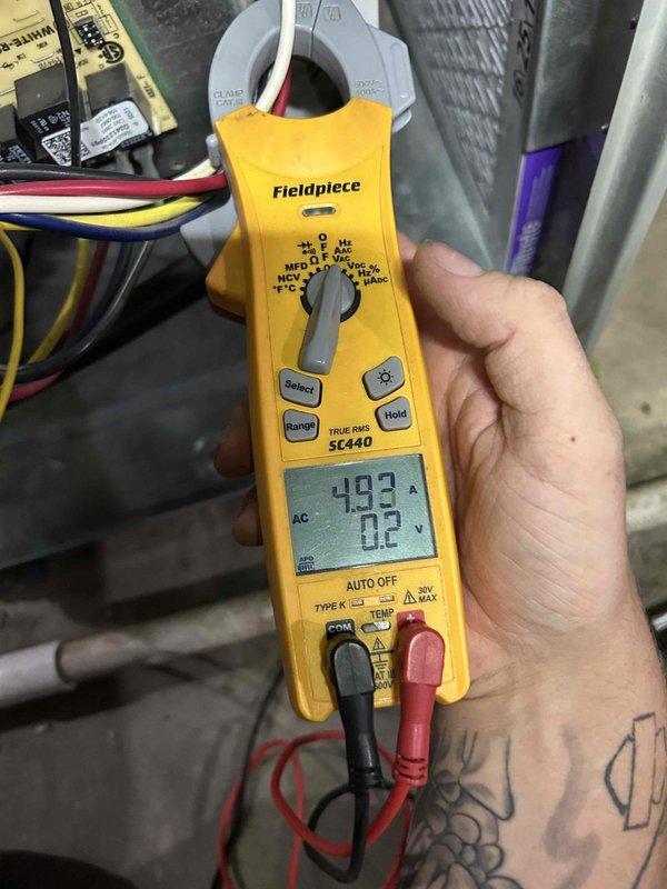 Completed comprehensive air conditioning tune-up and performance evaluation on gas furnace system located in basement as part of preventative maintenance care plan. Utilized Fieldpiece SC440 clamp meter to measure electrical parameters including capacitance readings of 493 MFD, verifying proper compressor and fan motor operation. Recorded supply air temperature of 53.5°F at the evaporator coil to confirm adequate cooling performance and refrigerant charge levels within manufacturer specifications.