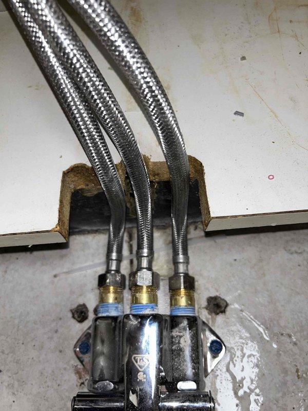 Responded to water leak complaint at sink in sterilization room. Inspected foot pedal assembly and confirmed intermittent leak caused by broken foot pedal mechanism. Documented existing plumbing configuration including P-trap assembly, supply lines, and manifold connections beneath sink. Part will be staged in warehouse for subsequent installation to resolve leak issue.