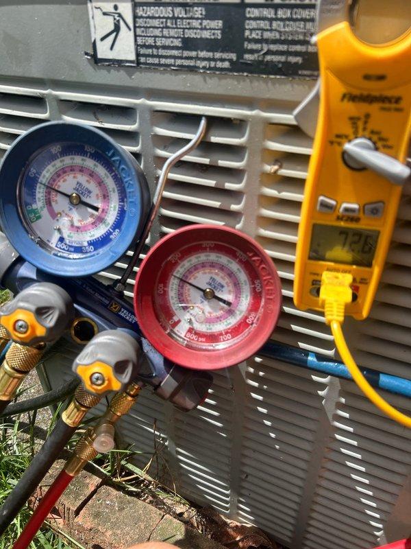 Completed annual Gold Level prepaid maintenance visit on a 26-year-old single system. Performed comprehensive system diagnostics using manifold gauges to check refrigerant pressures on outdoor heat pump unit. Measured system operating pressures with Yellow Jacket gauge set, confirming both high and low side readings were within acceptable parameters. Utilized Fieldpiece digital multimeter to verify electrical readings and system performance metrics. Confirmed proper filter size for the system during this first annual visit. Inspected outdoor unit housing and verified all warning labels were intact and legible. All diagnostic equipment readings indicated the aging system is currently operating within normal specifications for its age.