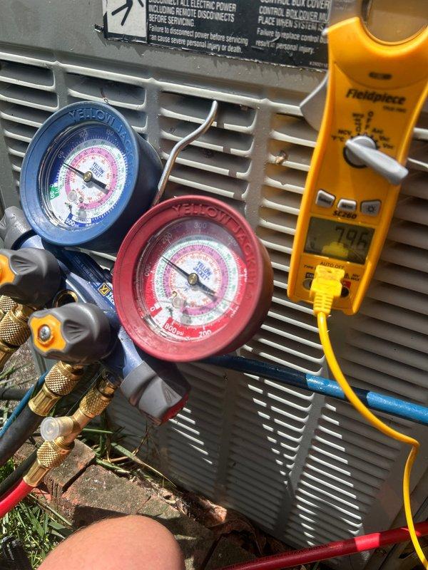 Completed annual Gold Level prepaid maintenance visit on a 26-year-old single system. Performed comprehensive system diagnostics using manifold gauges to check refrigerant pressures on outdoor heat pump unit. Measured system operating pressures with Yellow Jacket gauge set, confirming both high and low side readings were within acceptable parameters. Utilized Fieldpiece digital multimeter to verify electrical readings and system performance metrics. Confirmed proper filter size for the system during this first annual visit. Inspected outdoor unit housing and verified all warning labels were intact and legible. All diagnostic equipment readings indicated the aging system is currently operating within normal specifications for its age.