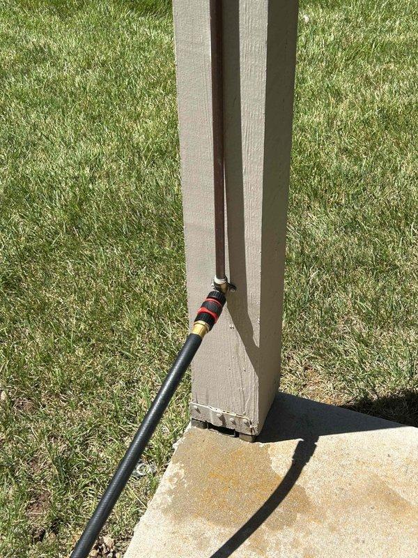 Responded to service call for burst copper water line mounted vertically on exterior deck post. The line, which supplied a hose connection for cleaning the second-level deck, had frozen and ruptured during winter months. Upon arrival, water supply was confirmed off and damage was assessed. Documented existing installation showing copper pipe secured to deck post with mounting brackets. Discussed freeze protection options with property owner including pipe insulation, heat tape application, and installation of frost-free hose bib with proper drainage slope. Photographed damaged copper line and mounting configuration for replacement planning and future reference.