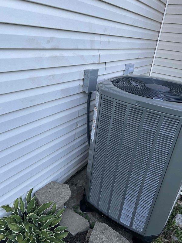 Completed full residential HVAC system installation for upstairs zone, installing a Trane 17 SEER2 3-ton multi-stage heat pump (model 5TWR7036) with variable speed air handler (model 5TEM6D06). Removed and properly disposed of existing equipment per code compliance requirements.

Installed outdoor condenser unit on concrete pad with snow legs for elevation and drainage. Mounted electrical disconnect box on exterior wall with electrical whip connection. Applied refrigerant line insulation and installed refrigerant line filter. Set and leveled unit, ensuring proper clearances from structure.

Interior air handler installation included BAYHTR1510 supplemental heat kit and variable speed blower configuration. Installed new return air ductwork to improve airflow distribution throughout the living space. Fabricated custom transitions to integrate with existing ductwork system. Installed standard-sized air filter rack for routine maintenance access.

Added comprehensive drain safety system in