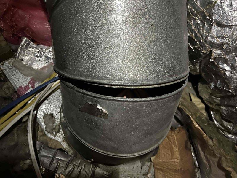 Responded to no heat complaint on aging upstairs HVAC system and evaluated underperforming mini-split unit. Upon inspection, discovered excessive condensation accumulation on main supply ductwork in attic space, indicating potential insulation deficiency or airflow restriction. Mini-split indoor air handler contained severely clogged air filter with heavy dust and debris buildup, significantly restricting airflow and reducing heating capacity. Cleaned and replaced filter on mini-split unit to restore proper air circulation and system performance. Advised on ductwork condensation issue and recommended monitoring system operation following filter replacement to ensure adequate heating output from mini-split.