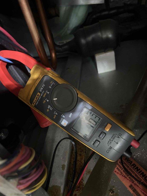 Responded to no cooling call on 15-year-old geothermal heat pump system with flashing red fault indicator at indoor unit. Performed diagnostic testing using digital multimeter and clamp meter to assess electrical parameters and compressor amperage draw. Identified system fault through electrical measurements and visual inspection of condensation patterns on ductwork, indicating potential issues with refrigerant circuit or compressor operation requiring further evaluation and repair recommendations.
