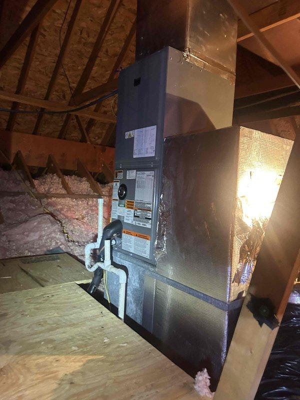 Responded to no cooling complaint on residential property with two HVAC systems, one confirmed over 10 years old with unknown original installer. Performed diagnostic assessment on attic-mounted air handler unit, inspecting refrigerant lines, ductwork connections, and overall system operation. Documented equipment condition and installation configuration with photographs for service records.