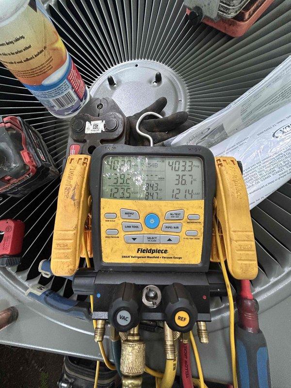 Completed full system installation of new Lennox 14.3 SEER2 5-ton air conditioning unit (model ML14KC10060-230) with matching evaporator coil (model CK40CT-60C-230) to replace existing equipment. Removed and properly disposed of old HVAC system per code requirements. Installed outdoor condenser unit on pad with new electrical disconnect box, whip kit, and insulated refrigerant lines with filter drier. Mounted indoor evaporator coil with transition to existing ductwork and installed SS2 coil drain safety water sensor for overflow protection. Installed new T10 thermostat with remote sensor for enhanced temperature control and zoning capability. Ran complete system diagnostics using manifold gauges to verify proper refrigerant charge, pressures, and temperatures across both indoor and outdoor units. Tested all electrical connections, verified proper amperage draw, and confirmed system operation through complete cooling cycle. Obtained all applicable permits and ensured installation meets 