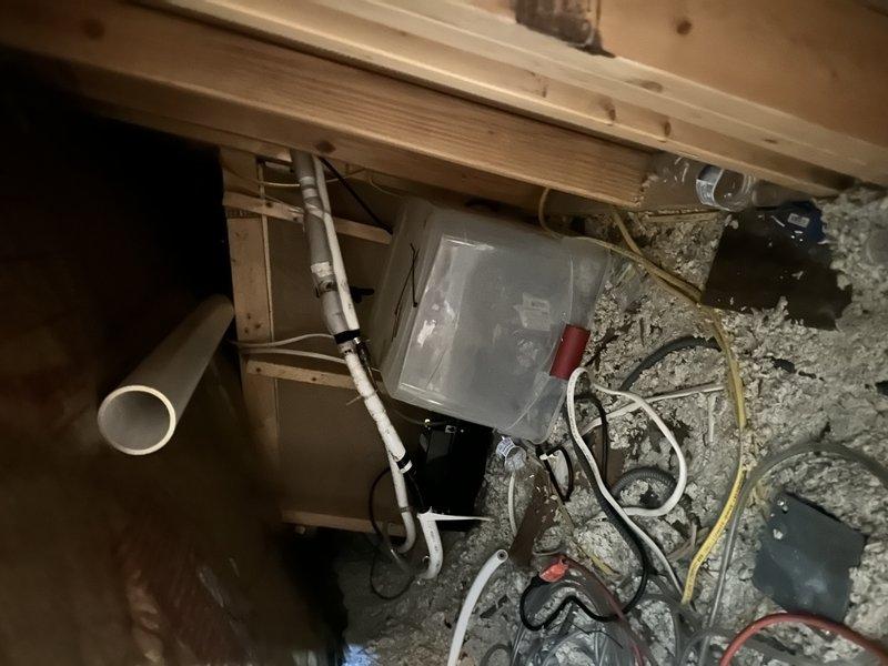 Responded to service call for mini-split system located in third-floor finished attic experiencing loud clanking noise during operation. Performed diagnostic evaluation of single-head mini-split unit and associated outdoor condensing unit. Assessed electrical connections, refrigerant lines, and mounting hardware to identify source of mechanical noise issue that had rendered system unusable, requiring homeowner to rely on temporary window unit for cooling.