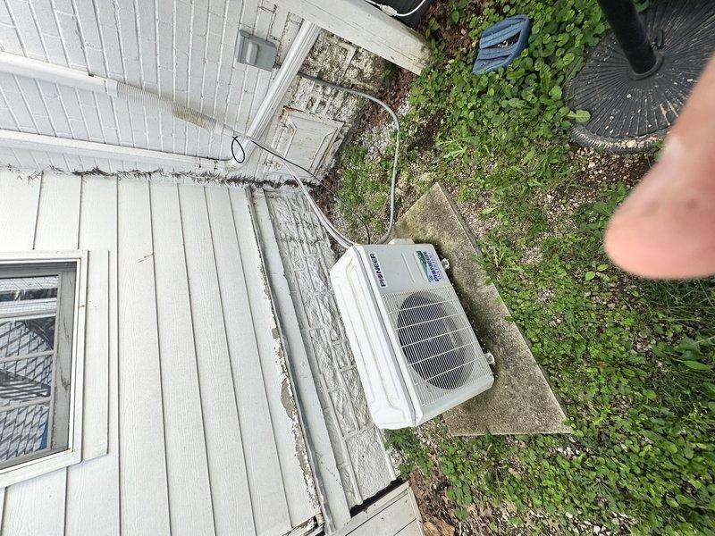 Responded to service call for mini-split system located in third-floor finished attic experiencing loud clanking noise during operation. Performed diagnostic evaluation of single-head mini-split unit and associated outdoor condensing unit. Assessed electrical connections, refrigerant lines, and mounting hardware to identify source of mechanical noise issue that had rendered system unusable, requiring homeowner to rely on temporary window unit for cooling.