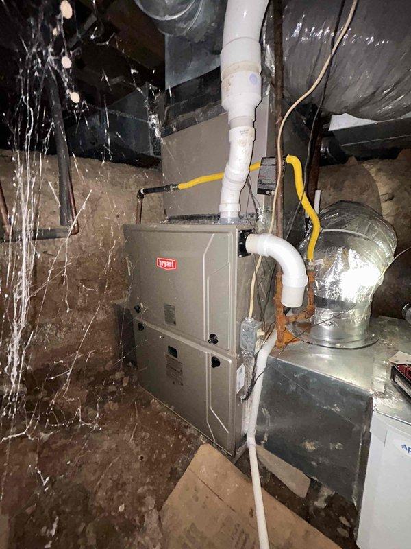 Completed Gold Level prepaid maintenance on dual-system home with one gas furnace unit located in crawl space and second unit in upstairs attic space. Performed comprehensive inspection and preventive maintenance on both Bryant HVAC systems including visual examination of furnace cabinets, ductwork connections, PVC condensate drainage lines, and electrical conduit. Provided replacement air filter for crawl space unit as specified, while homeowner supplied filter for upstairs unit. Verified proper operation of both heating systems, checked all accessible ductwork for secure connections and adequate insulation, and confirmed flue pipe integrity on both installations. All equipment operating within normal parameters at time of service completion.