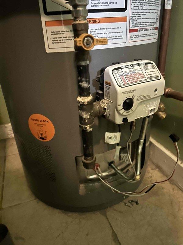 Responded to no hot water complaint on 6-year-old residential gas water heater. Upon arrival, confirmed pilot light was extinguished, likely due to recent storm activity. Inspected gas control valve, thermocouple, and burner assembly for proper operation. Successfully relit pilot light following manufacturer specifications and verified stable flame. Tested gas control valve functionality and confirmed proper temperature settings. Checked pressure relief valve, supply lines, and all plumbing connections for leaks or damage. Verified adequate combustion air supply and proper venting. Unit restored to full operation with hot water production confirmed before departure.