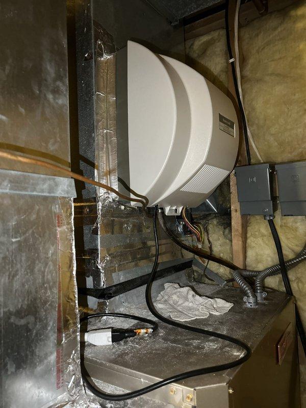 Responded to service call for 50-gallon standard electric water heater exhibiting burnt smell, visible burnt marks on lower heating element, and water leakage at base of unit. Upon inspection, confirmed unit was over 10 years old with significant deterioration and moisture damage visible on concrete floor surrounding the Bradford White water heater. Due to age of unit, compromised lower element, active water leak, and potential safety concerns from burnt electrical components, recommended and performed complete water heater replacement. Removed existing failed unit, installed new 50-gallon electric water heater with proper electrical connections and plumbing hookups including copper supply lines and appropriate safety devices. Tested new installation for proper operation, verified no leaks at connections, and confirmed adequate hot water production. Removed old unit from premises and left work area clean.