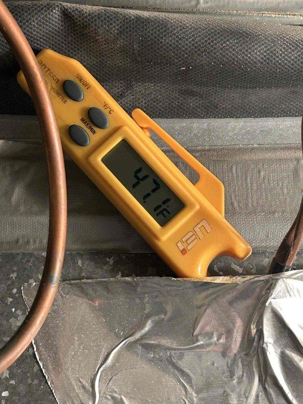 Responded to downstairs HVAC system with reported condensate line blockage and overflow condition. Upon arrival, inspected older heating system unit and verified condensate drain pan was near capacity. Cleared clogged condensate drain line using appropriate tools and techniques to restore proper drainage flow. Verified system operation and confirmed condensate is now draining properly with no further overflow risk.