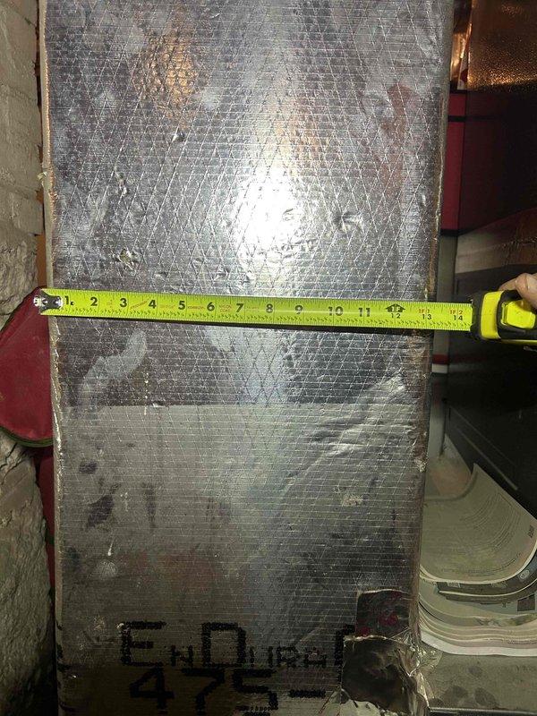 Responded to basement flooding incident affecting HVAC system. Performed comprehensive safety inspection of furnace unit that had been submerged and powered off as precautionary measure. Conducted visual assessment of equipment interior, checking for water damage, contamination, and potential mold growth. Measured internal temperature at 53.9°F and inspected reflective duct insulation for water intrusion and structural integrity. Documented water line marks approximately 14 inches high on insulation material, indicating flood depth. Evaluated foil-faced insulation for signs of moisture retention, degradation, and microbial growth concerns. Inspected electrical components, wiring, and connections for water exposure and corrosion. Unit remains de-energized pending further assessment and drying period. Recommend professional water damage remediation, thorough drying of all components, and follow-up inspection before restoration of service to ensure safe operation.